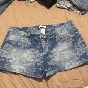 Candies Floral patterned jean shorts.
